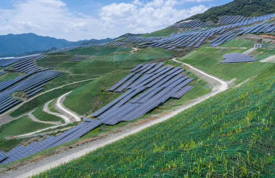 Mountain PV plant eco-restoration area covered with green camouflage netting