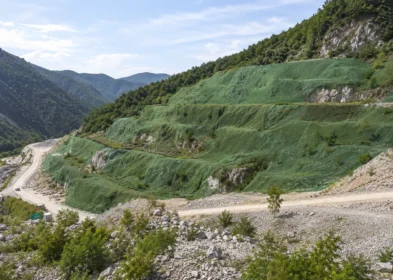 Abandoned mine slope covered with ecological camouflage net for restoration