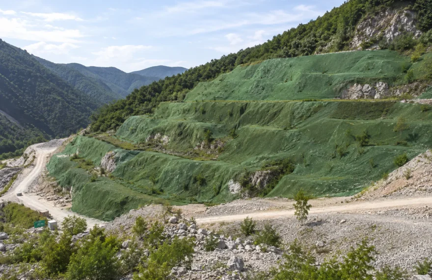 Abandoned mine slope covered with ecological camouflage net for restoration