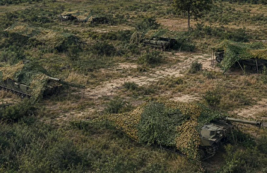Armored unit concealment demonstration using terrain-matched camouflage netting