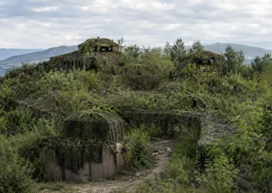 Fixed reconnaissance position renovated with full camouflage net cover