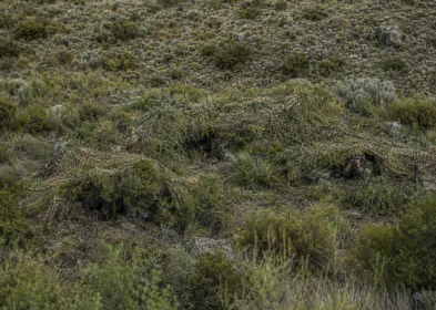 Infantry observation position concealed with lightweight camouflage netting
