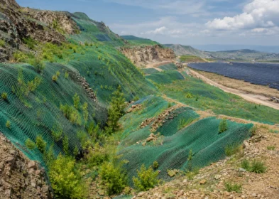 Mining ecological restoration slope covered by green camouflage net