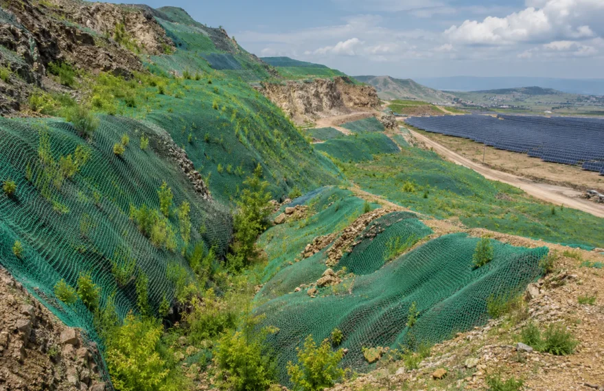 Mining ecological restoration slope covered by green camouflage net